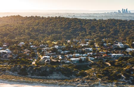 Aerial Image of CITY BEACH TOWARDS PERTH CBD AT SUNRISE