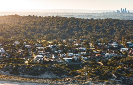 Aerial Image of CITY BEACH TOWARDS PERTH CBD AT SUNRISE