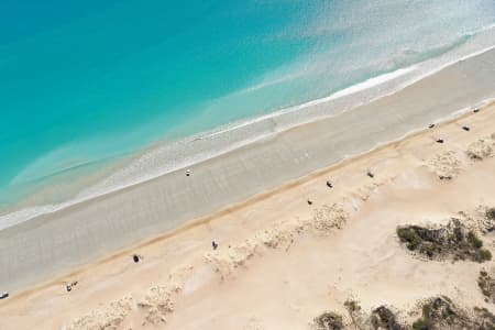 Aerial Image of CABLE BEACH, LOOKING DOWN UPON CARS DOTTED ALONG THE SANDS