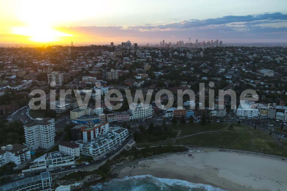 Aerial Image of Bondi, Tamarama & Sydney Silhouettes At Dusk