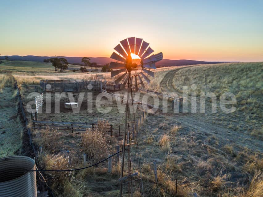 Aerial Image of A windmill and cattle yards at sunset at Mount Franklin