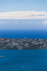 Aerial Image of BLUE SKIES AND WHITE CLOUDS OVER THE HARBOUR