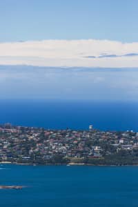 Aerial Image of BLUE SKIES AND WHITE CLOUDS OVER THE HARBOUR