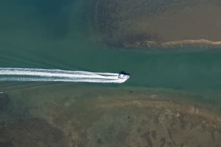 Aerial Image of PHOTO OF BOAT IN WATER WITH WAKE
