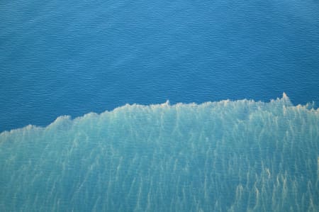 Aerial Image of BREAKING WAVE OFF WAIPU.