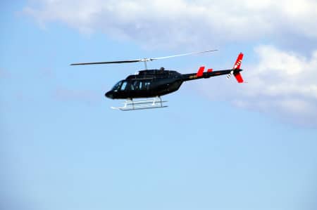 Aerial Image of CHOPPER FLYING DOWN THE PARRAMATTA RIVER